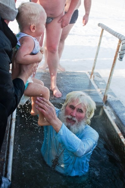 Dipping a child in an ice hole on Epiphany