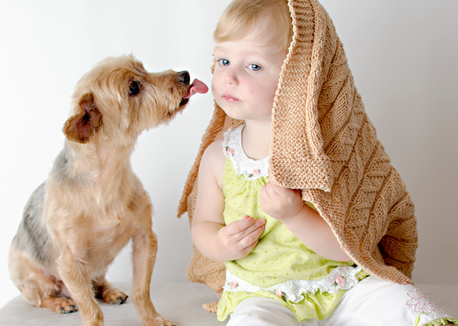 child and dog in the house